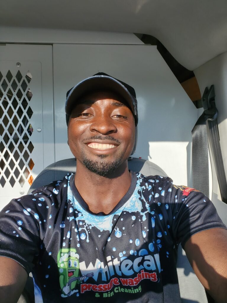 Whitecap Pressure Washing professional in company uniform